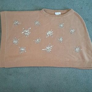 Asymmetrical poncho.